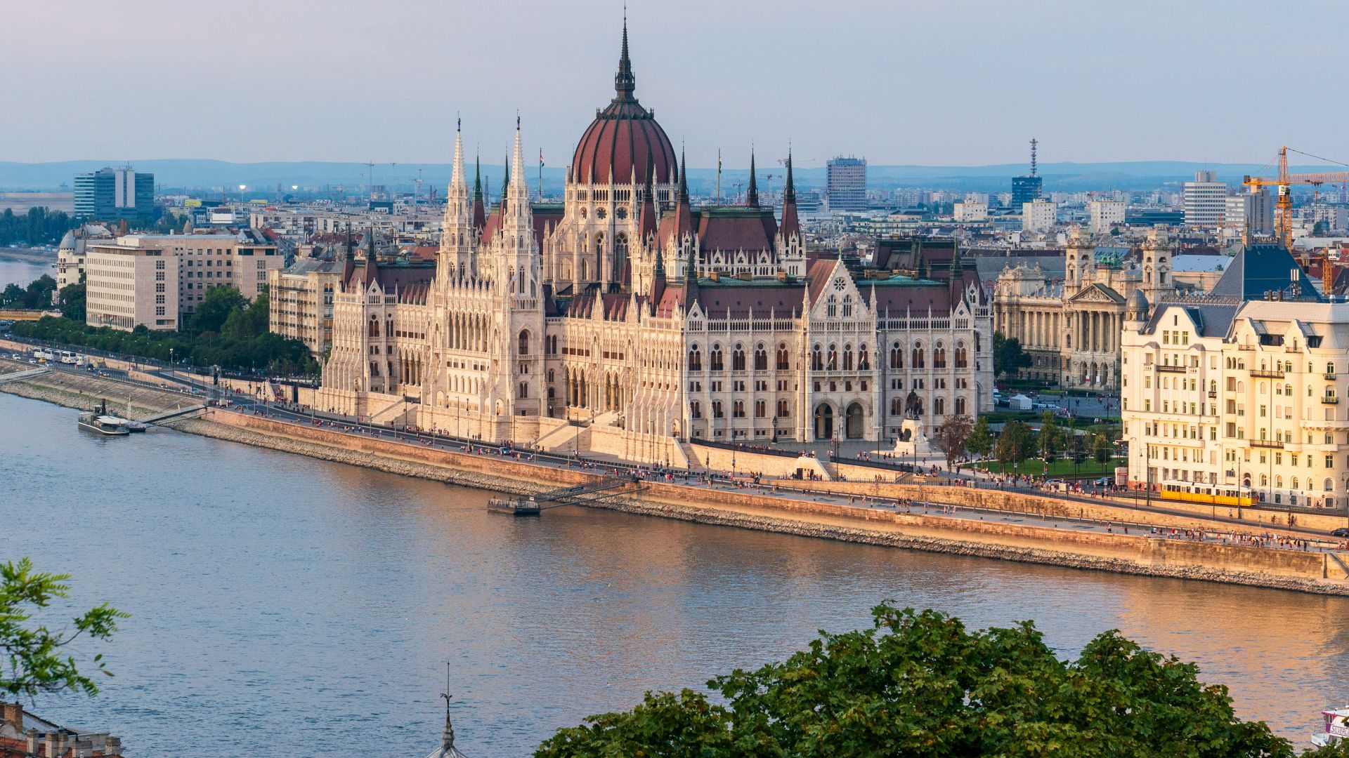 brown concrete building near body of water during daytime