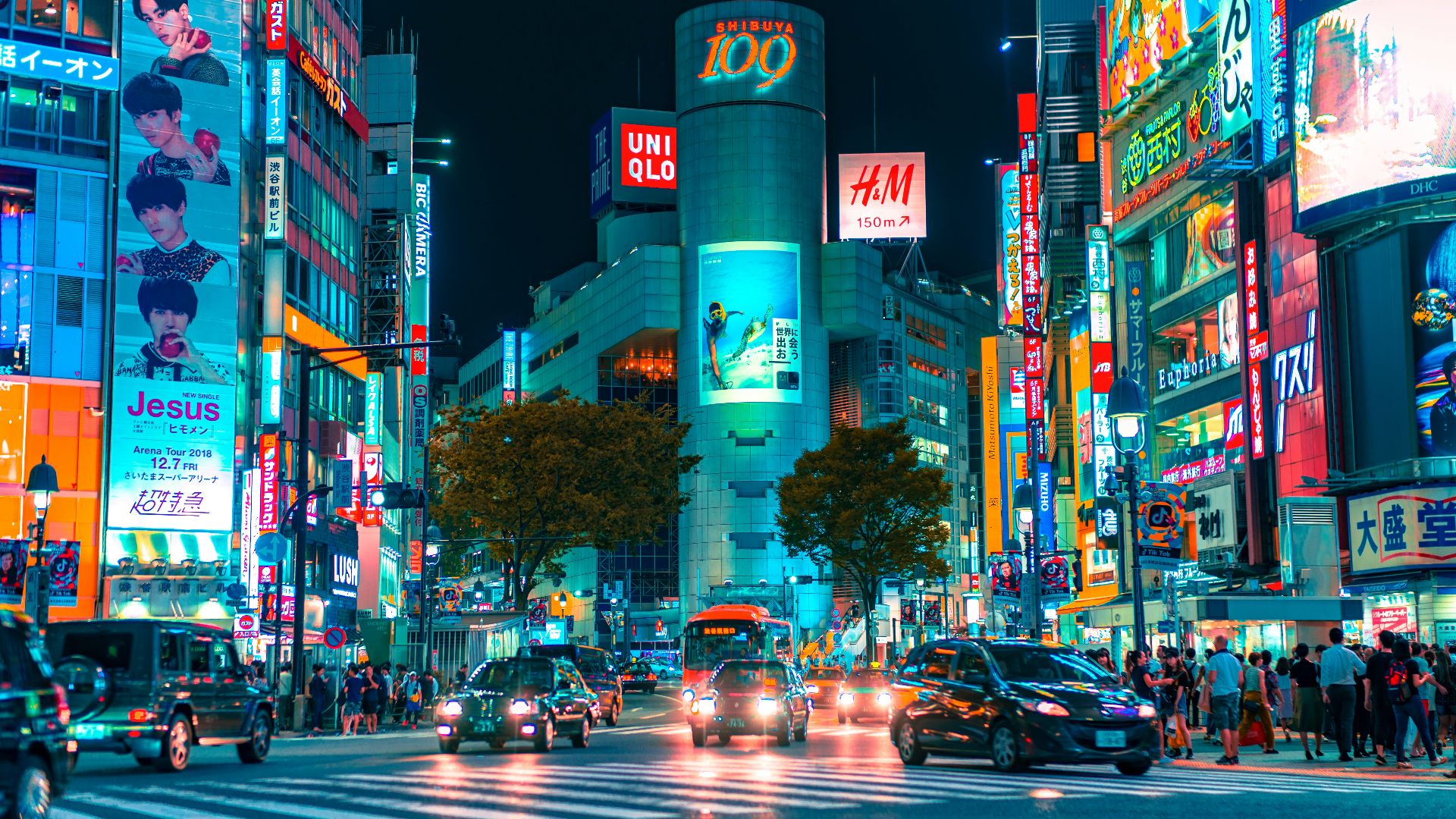 people gathered outside buildings and vehicles