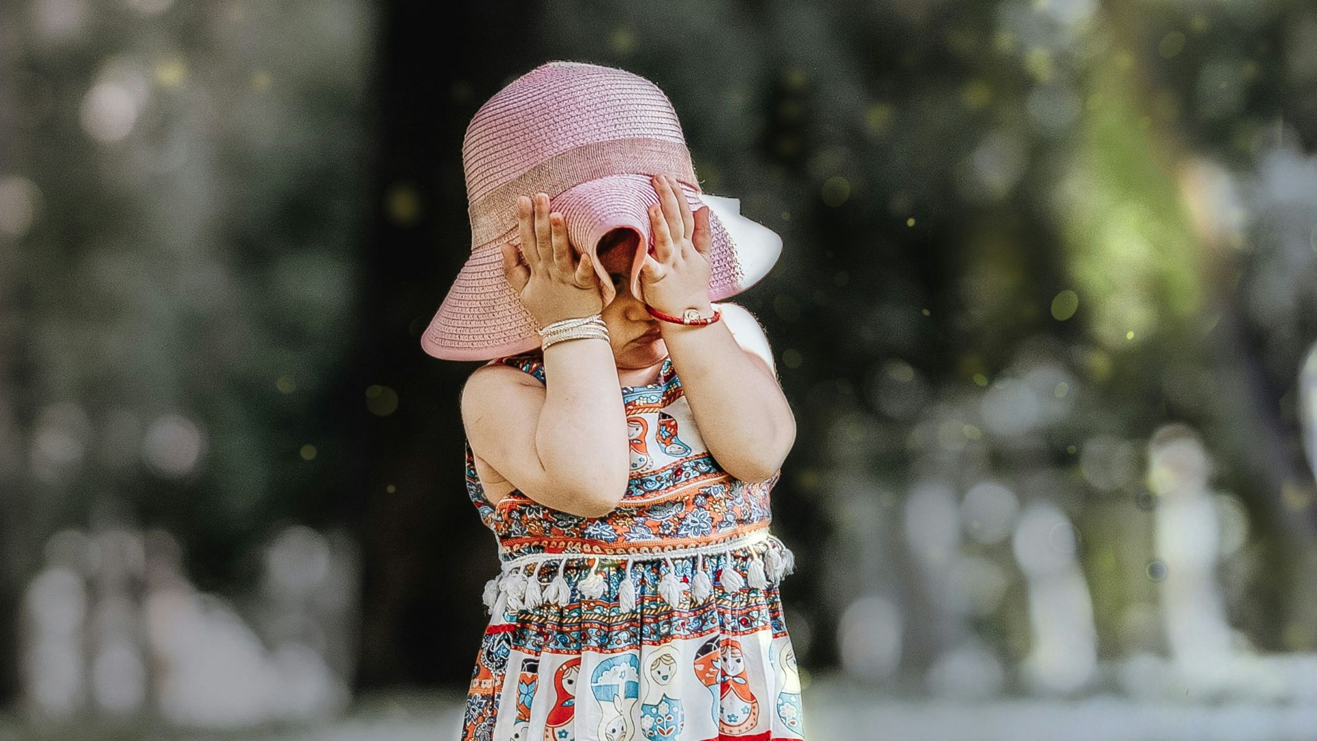girl covering own face