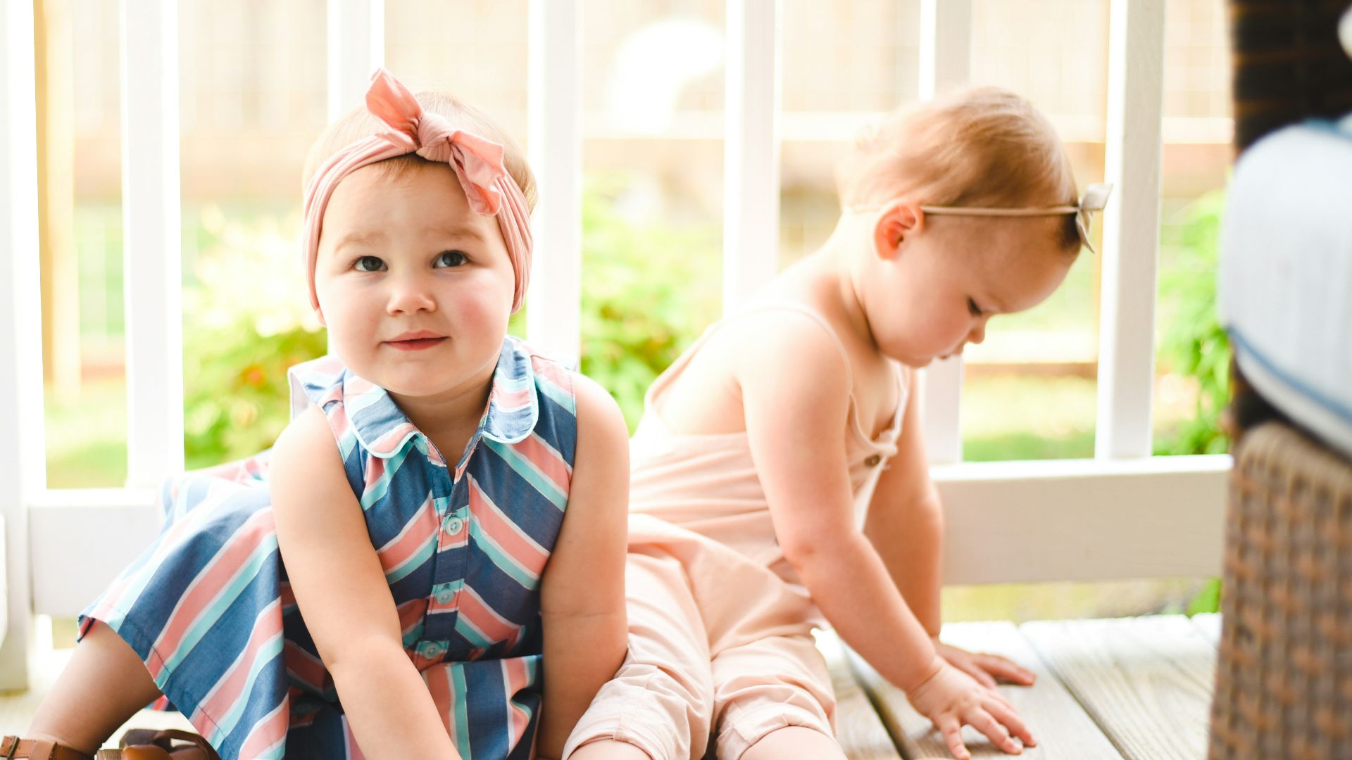 two babies on porch