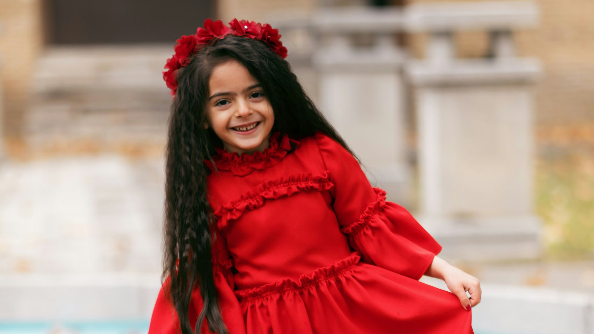 smiling girl holding her dress