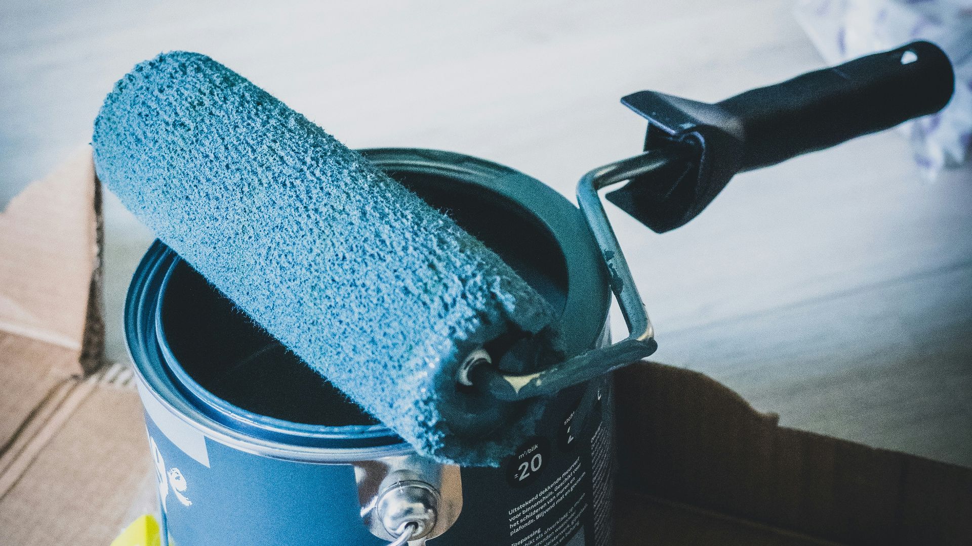 blue and white can on white table