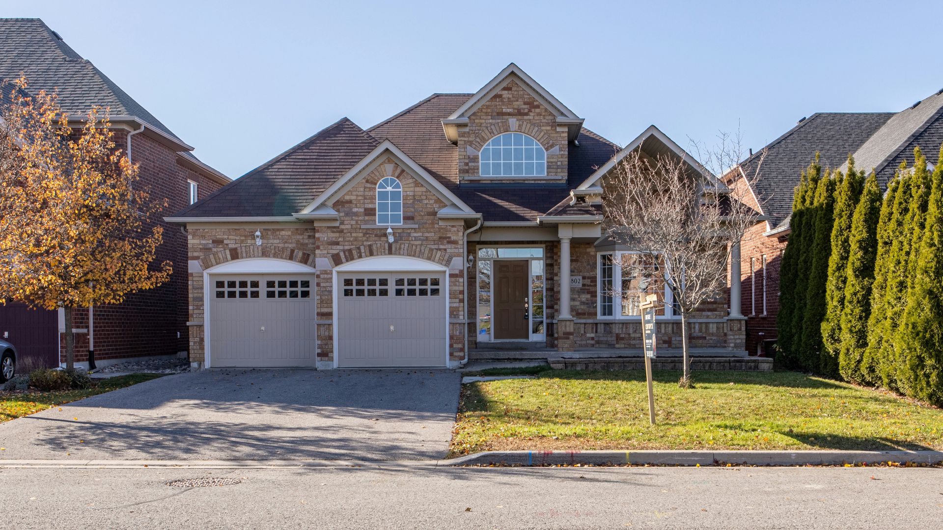 brown and white concrete house under blue sky during daytime
