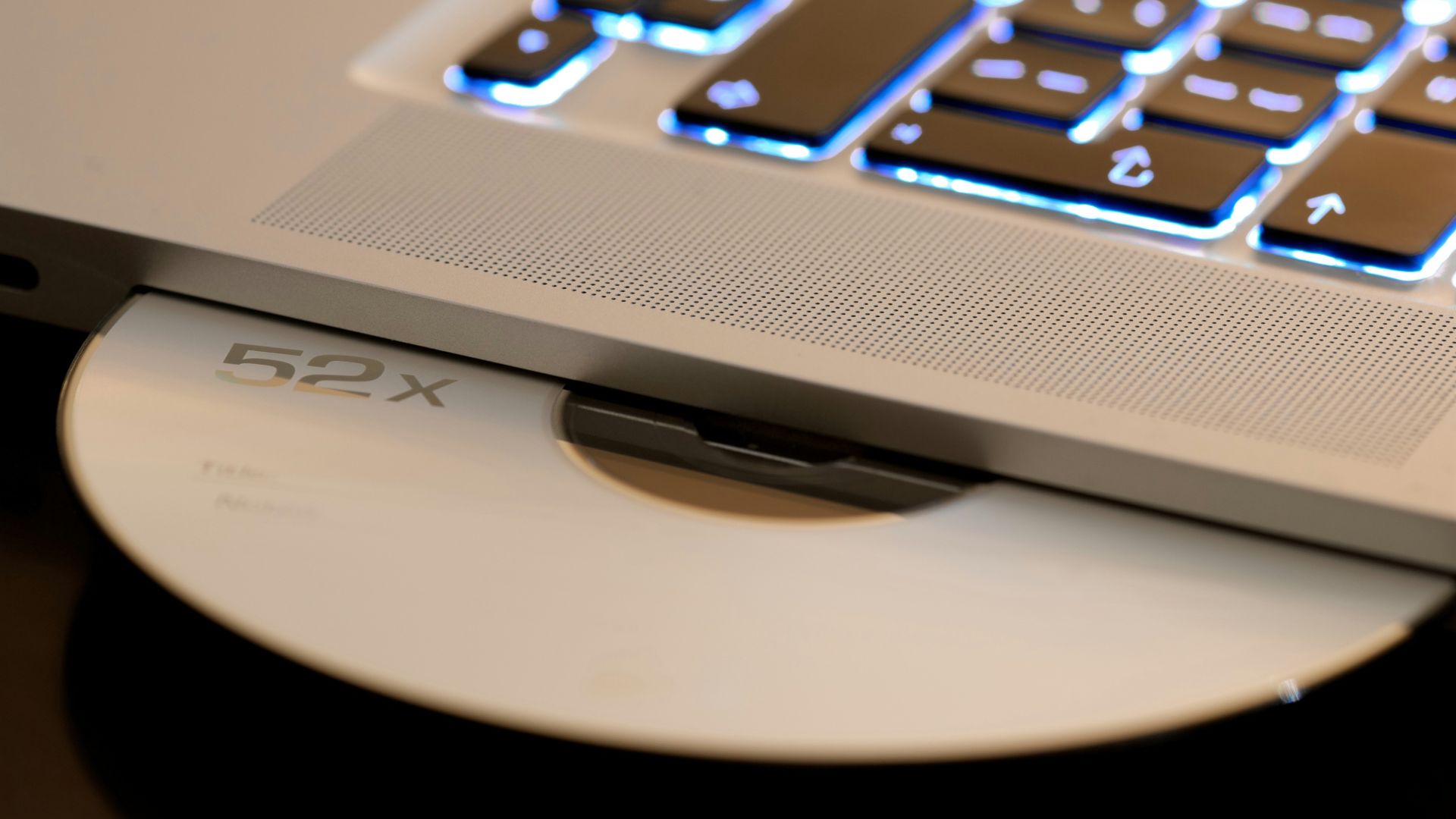 white disc on laptop computer disc player