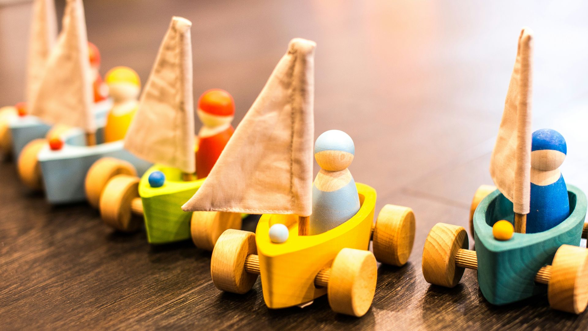 five assorted-color racing car toys