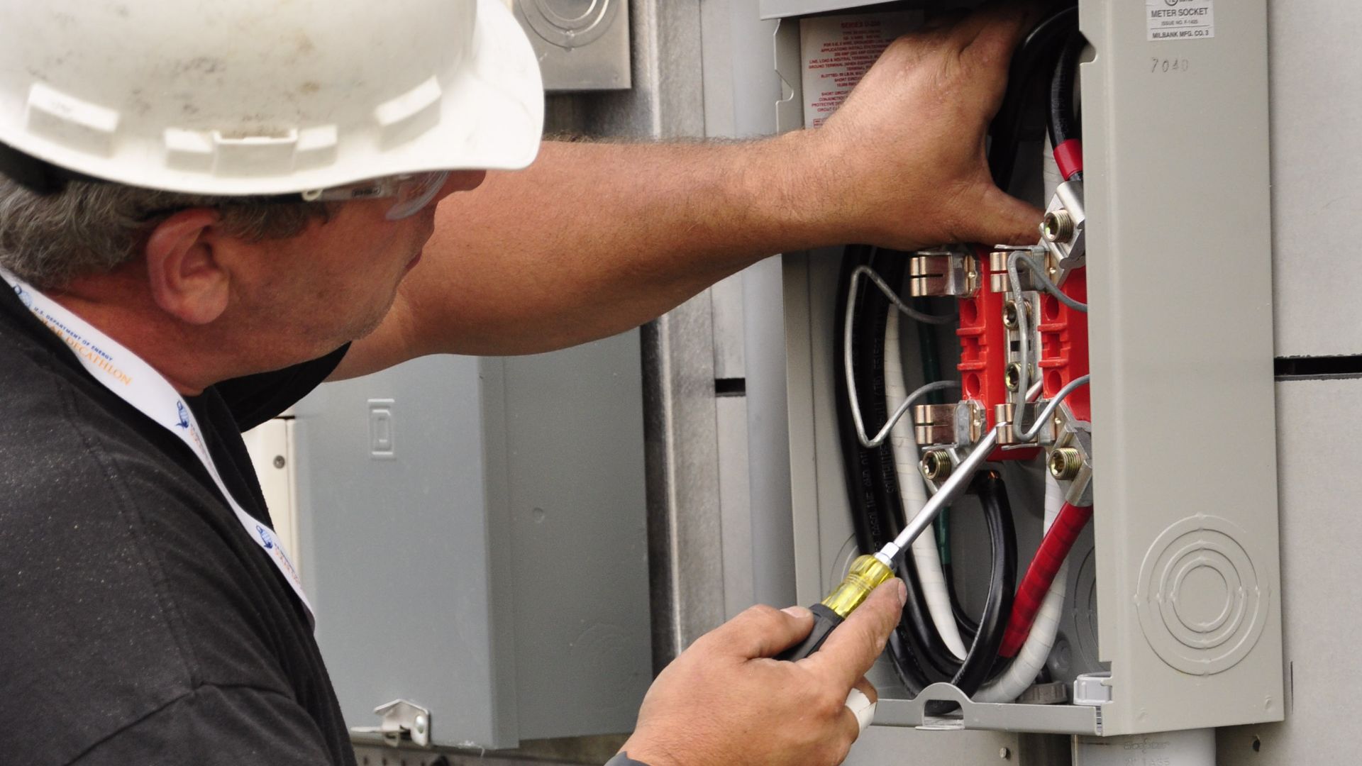 File:Electrician Mike Hughes Installing Meter Base.jpg