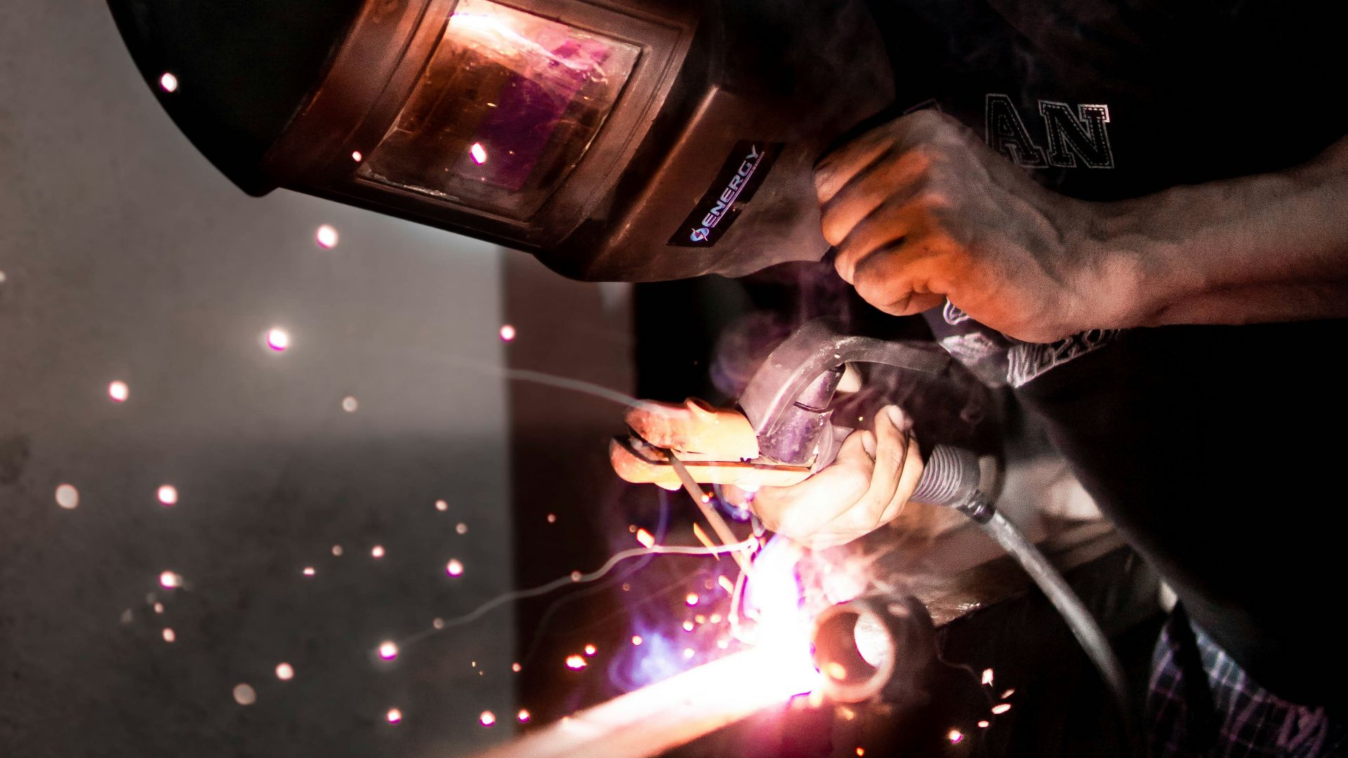 person holding black and clear glass lamp