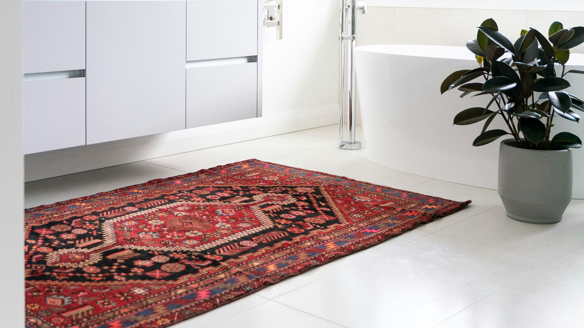 green potted plant on white wooden cabinet