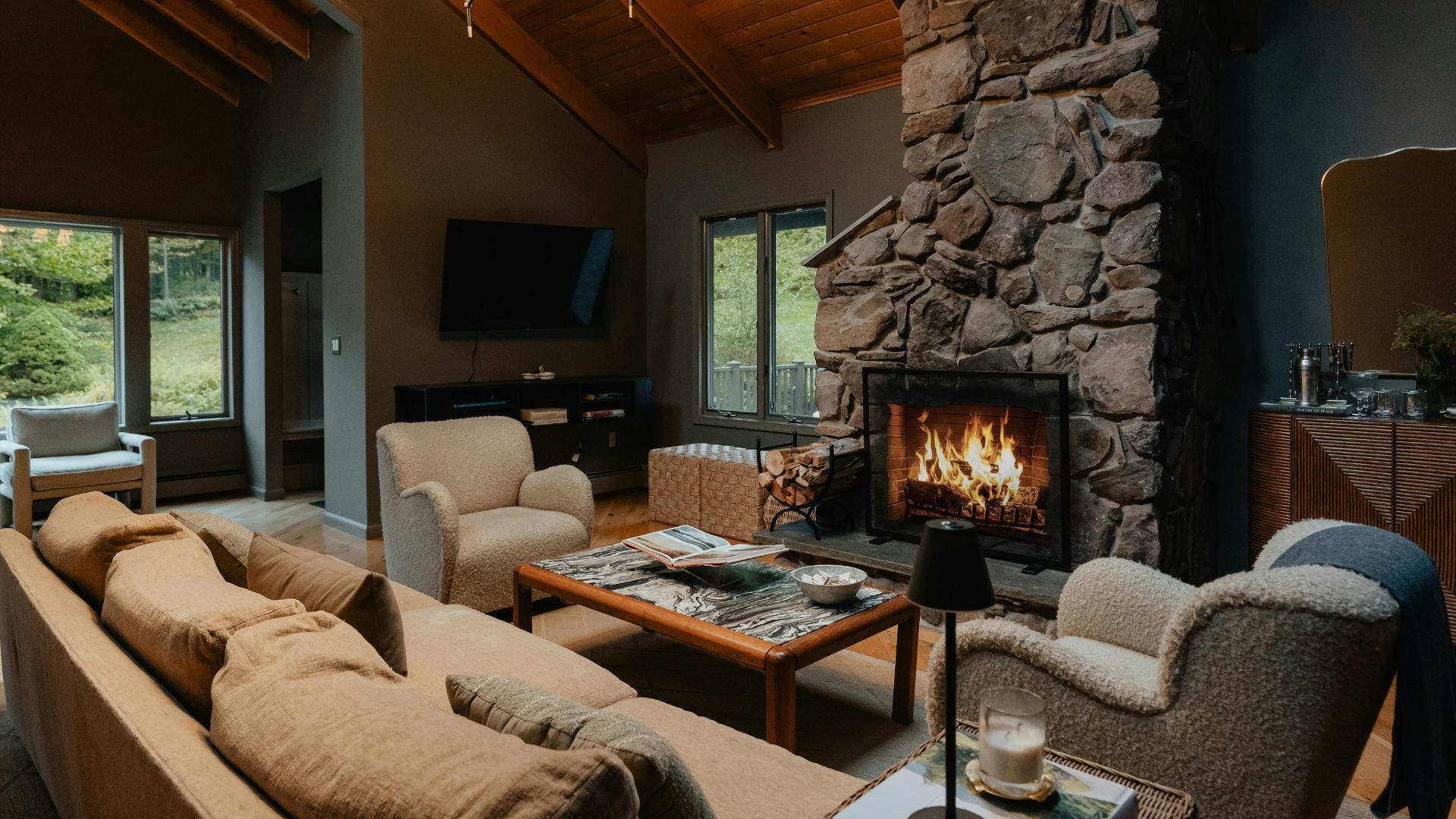 a living room filled with furniture and a fire place