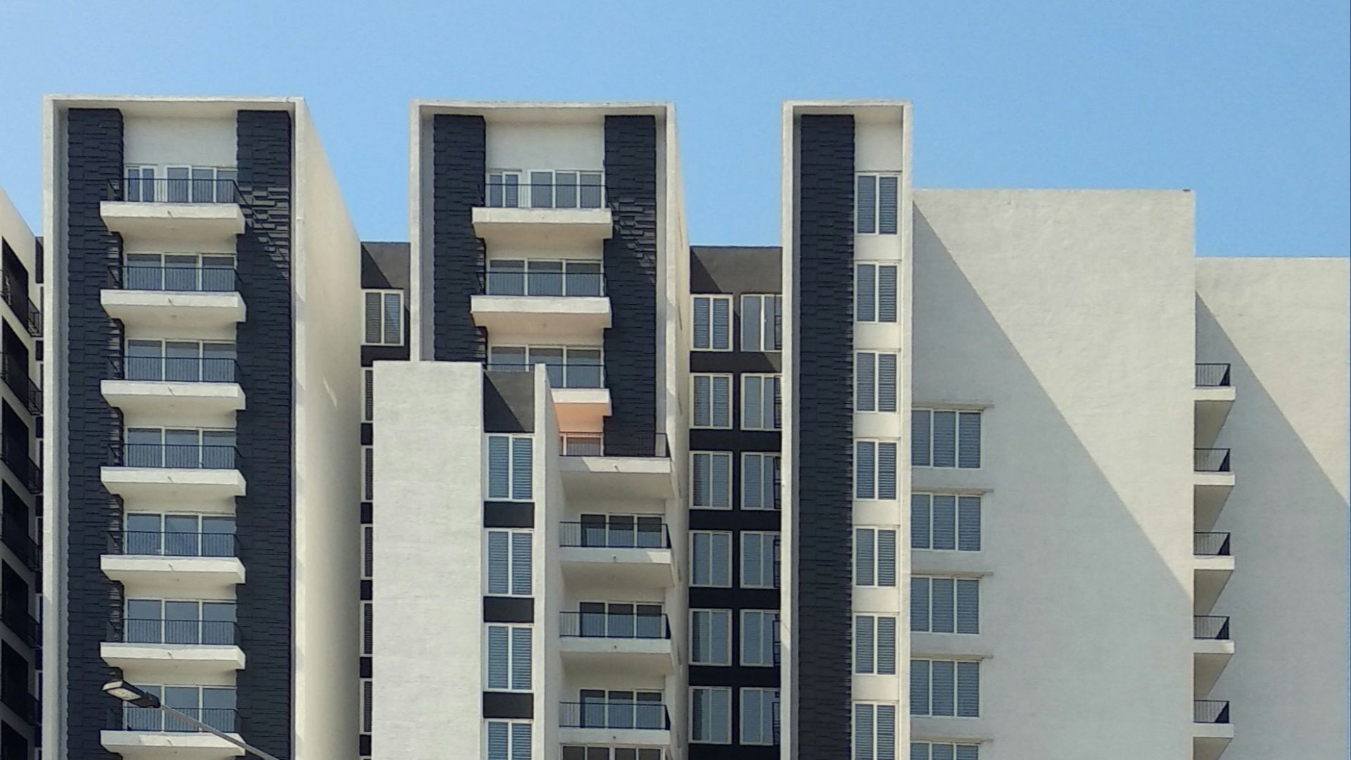 white concrete building under blue sky during daytime