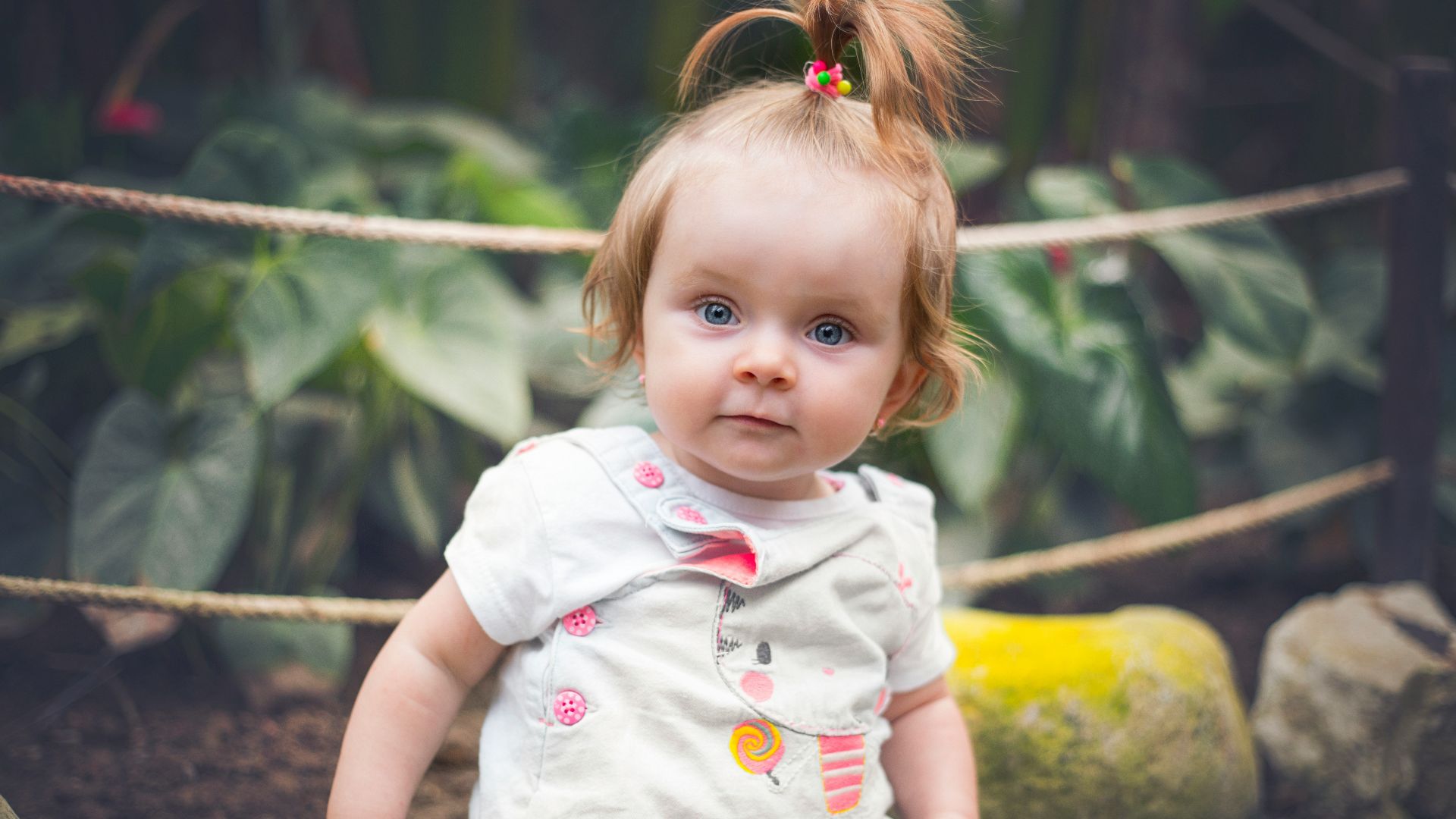 girl in white and pink floral dress