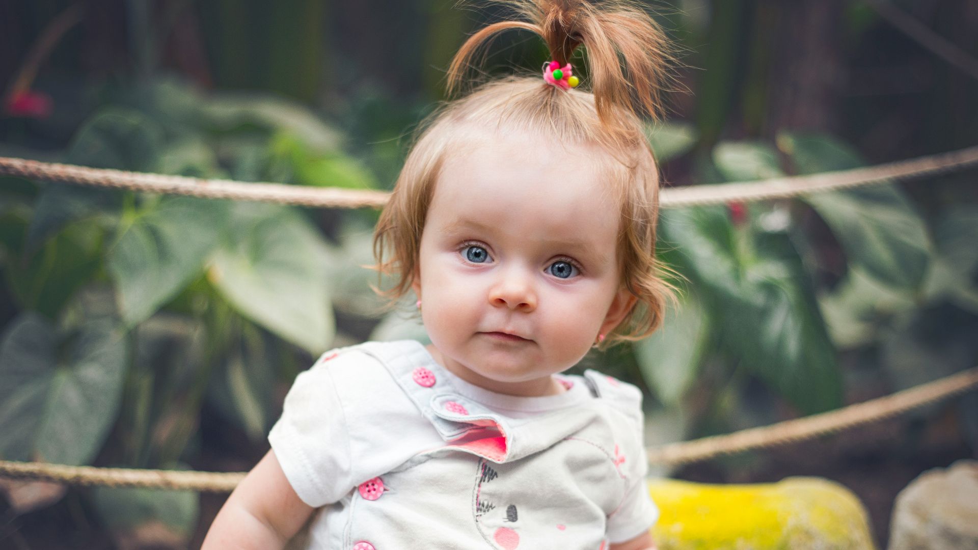 girl in white and pink floral dress
