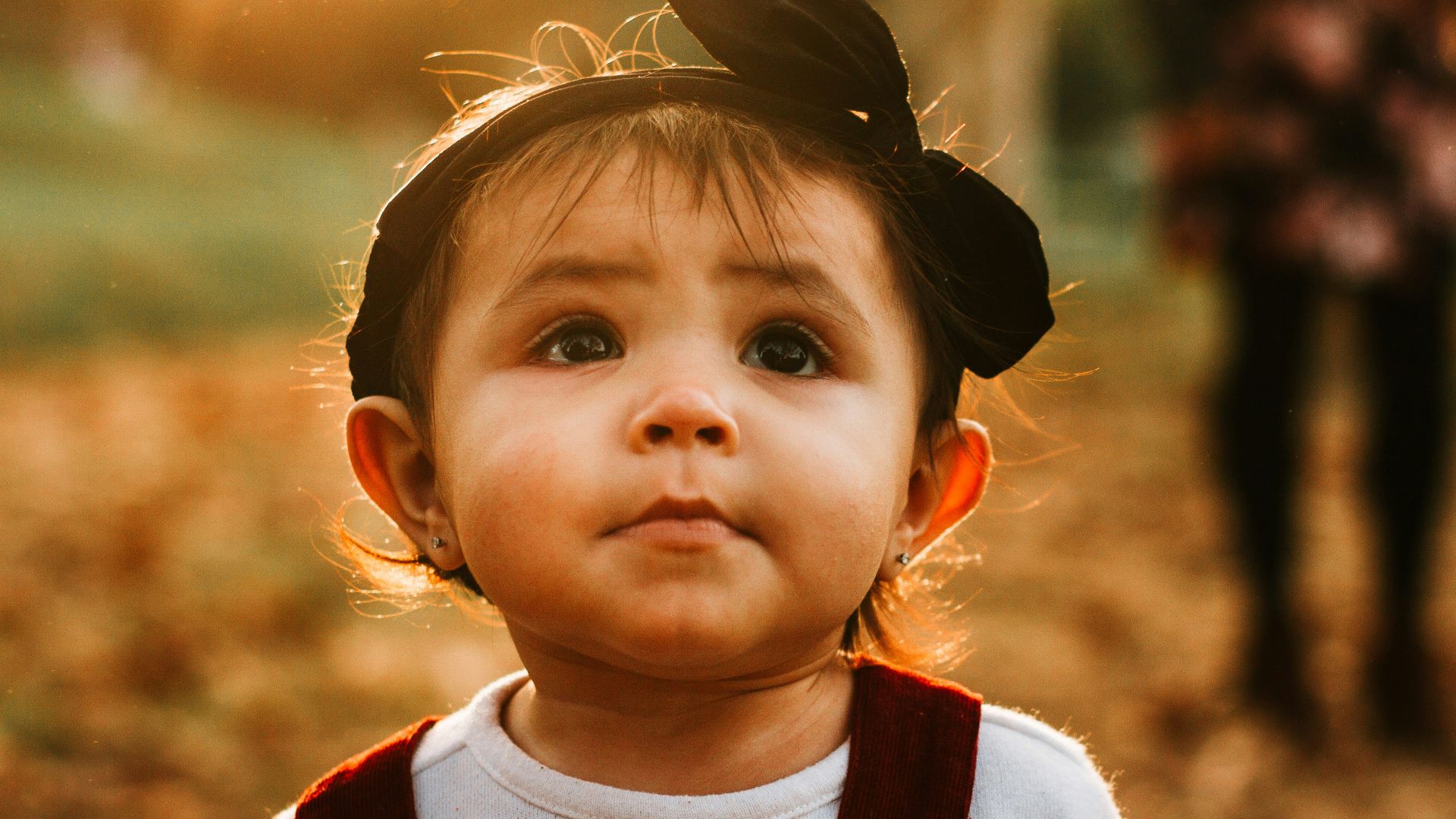 toddler wearing black headband