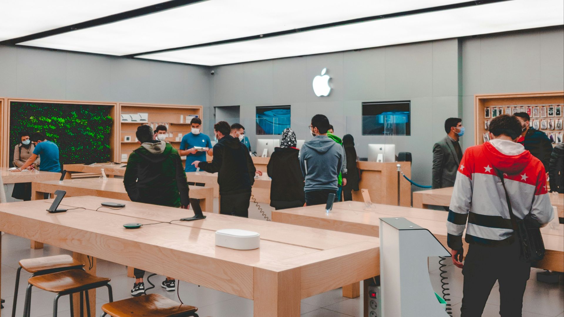 people standing and sitting inside room