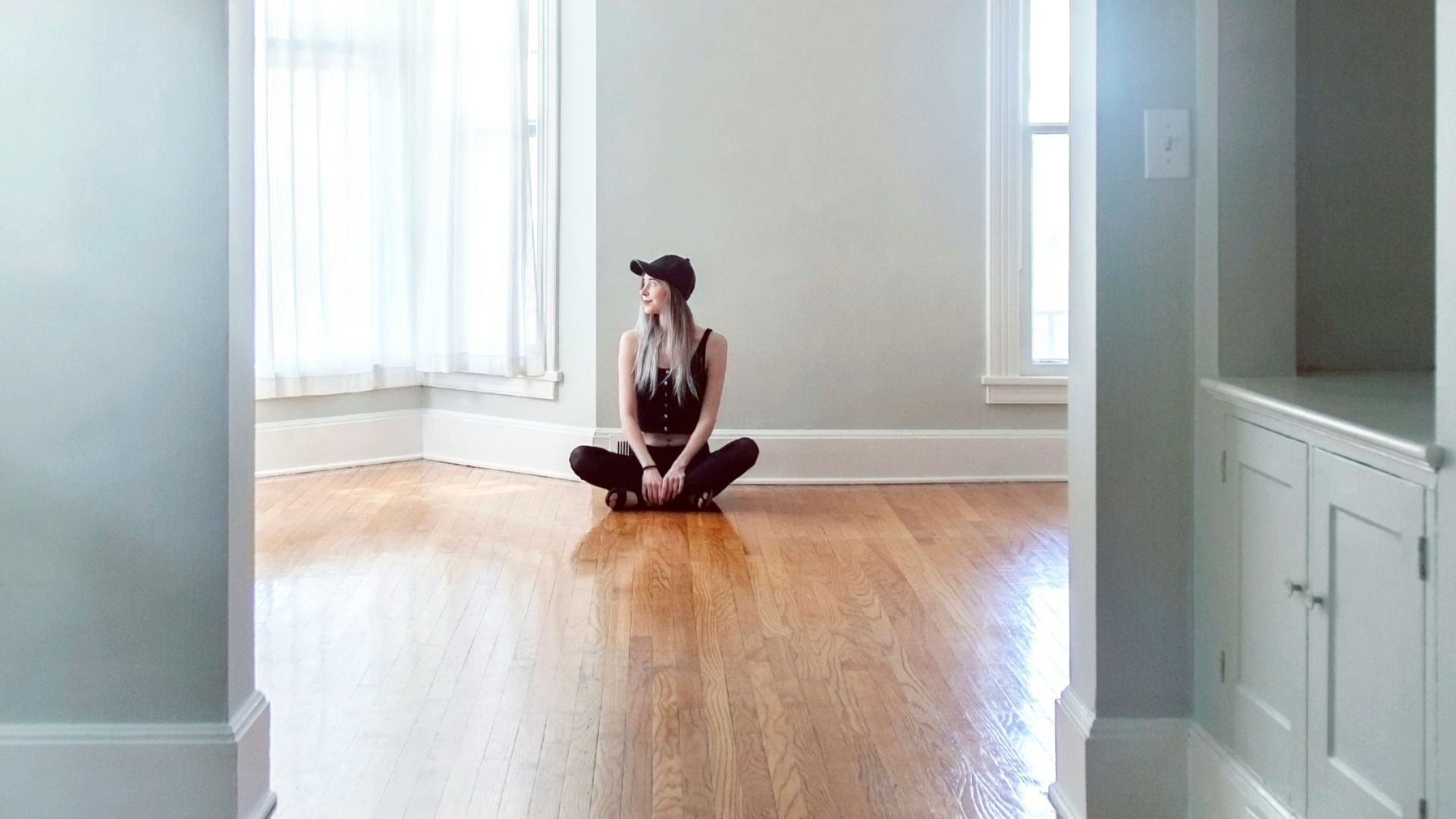 brown short coated dog on brown wooden parquet floor