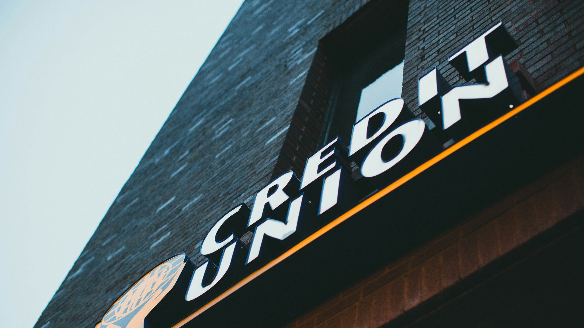 a sign on the side of a brick building