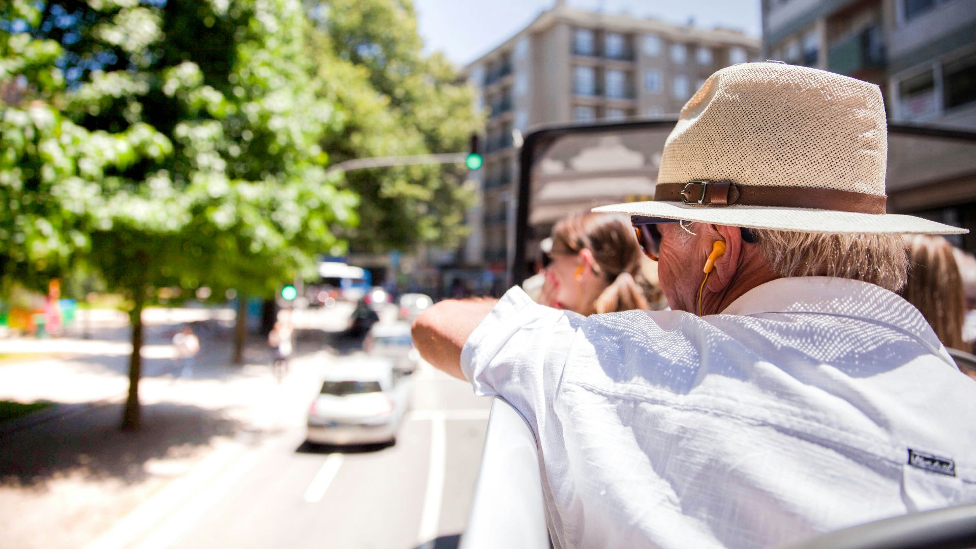 man in white dress shirt and brown fedora hat
