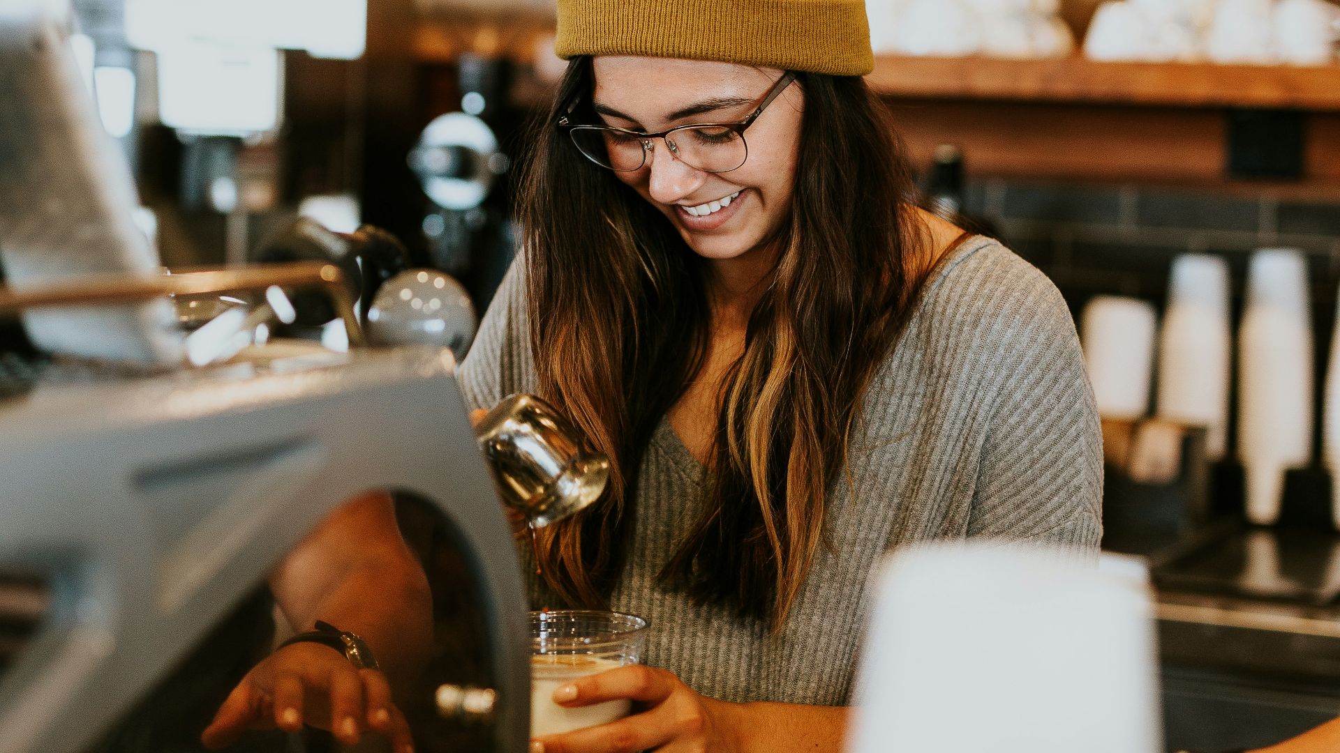 woman holding clear drinking glass