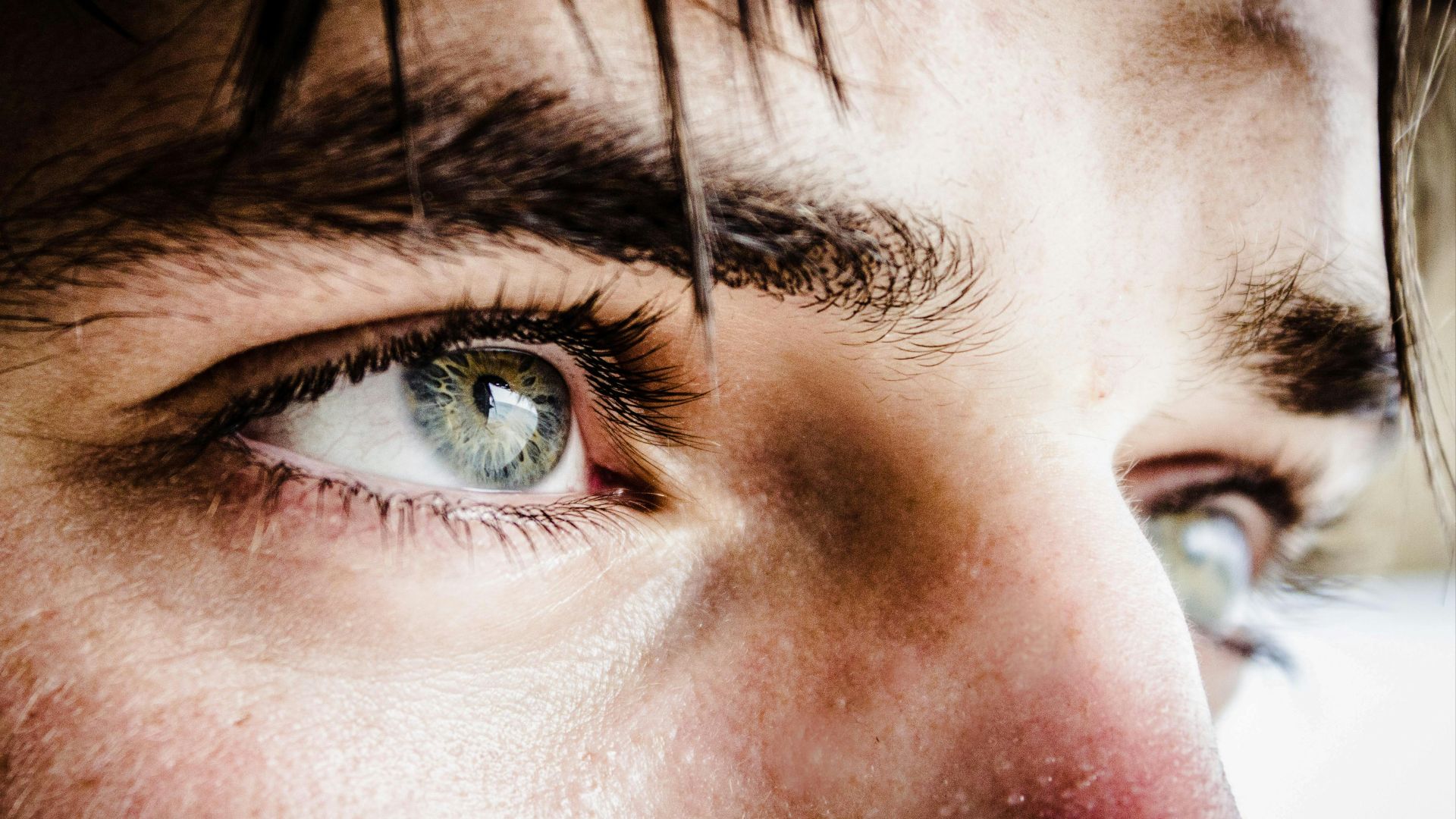 close up photo of gray-eyed man