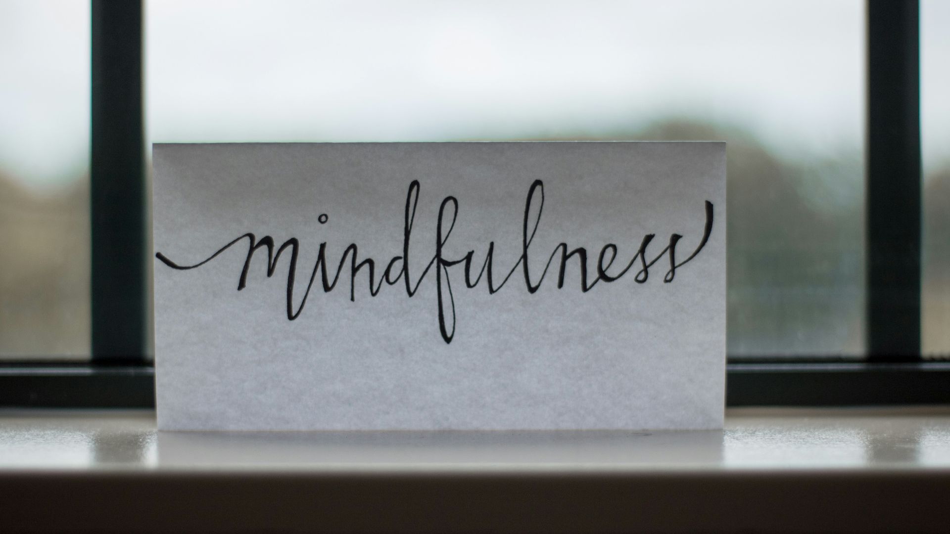 mindfulness printed paper near window
