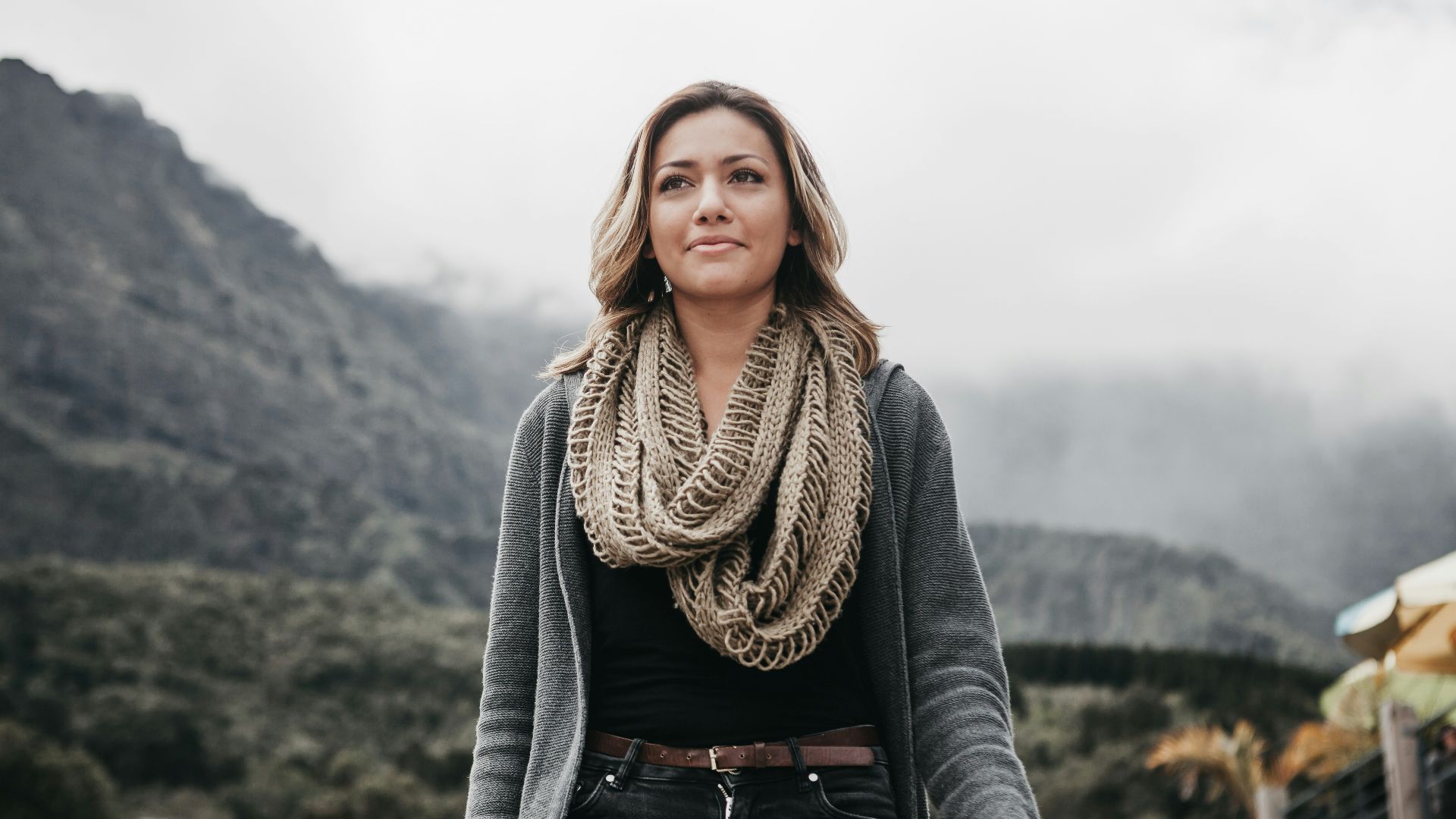 woman wearing gray cardigan and brown scarff