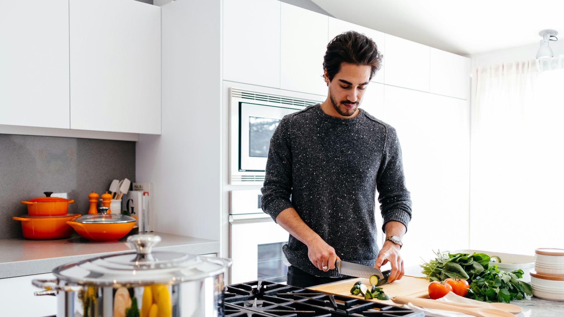 man cutting vegetables