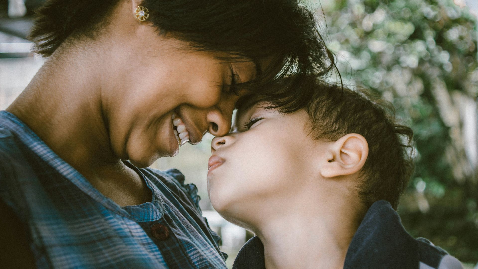 selective focus photography of woman and boy