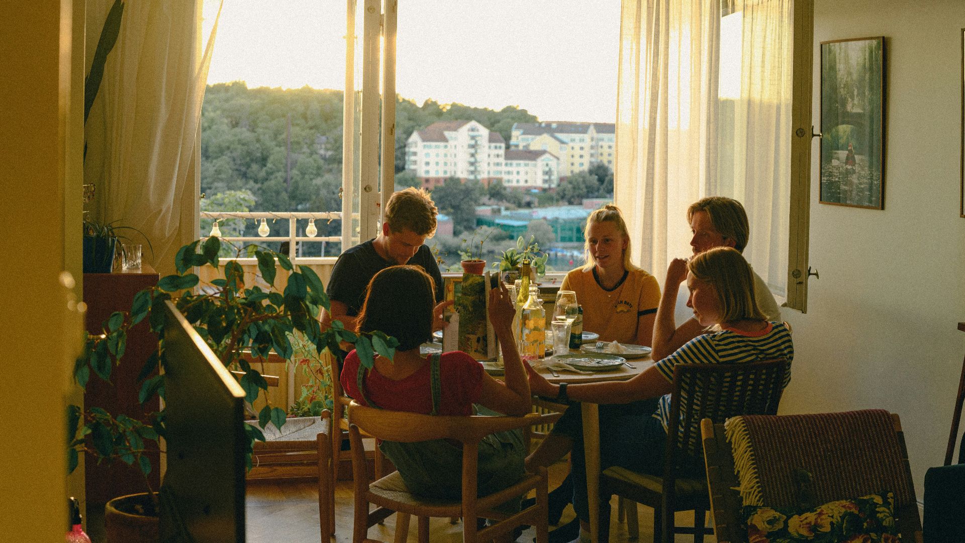 a group of people sitting around a table