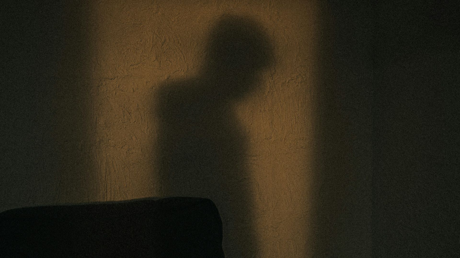 black sofa chair near white wall