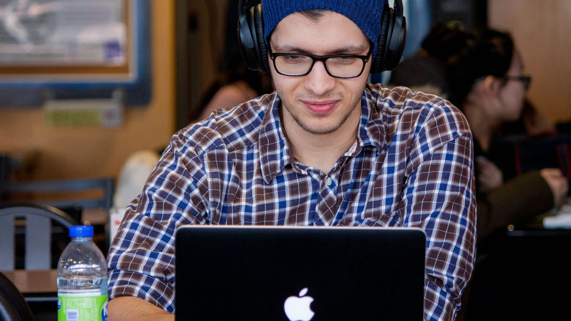 man using MacBook during daytime