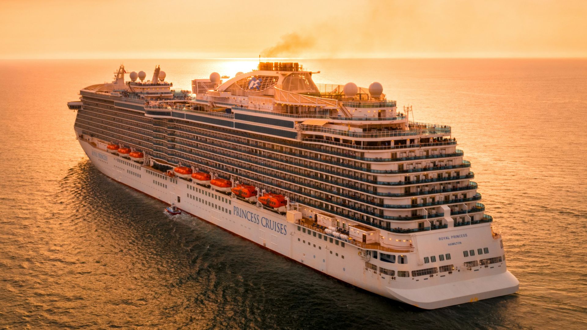 white ship on sea during sunset