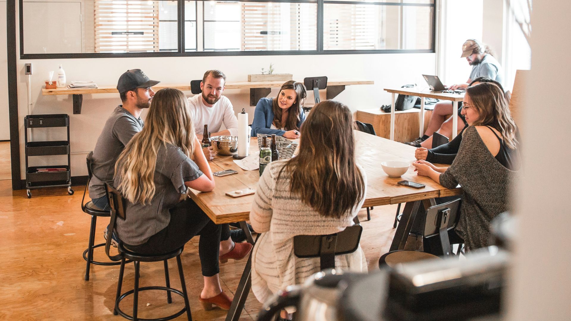 talking people sitting beside table