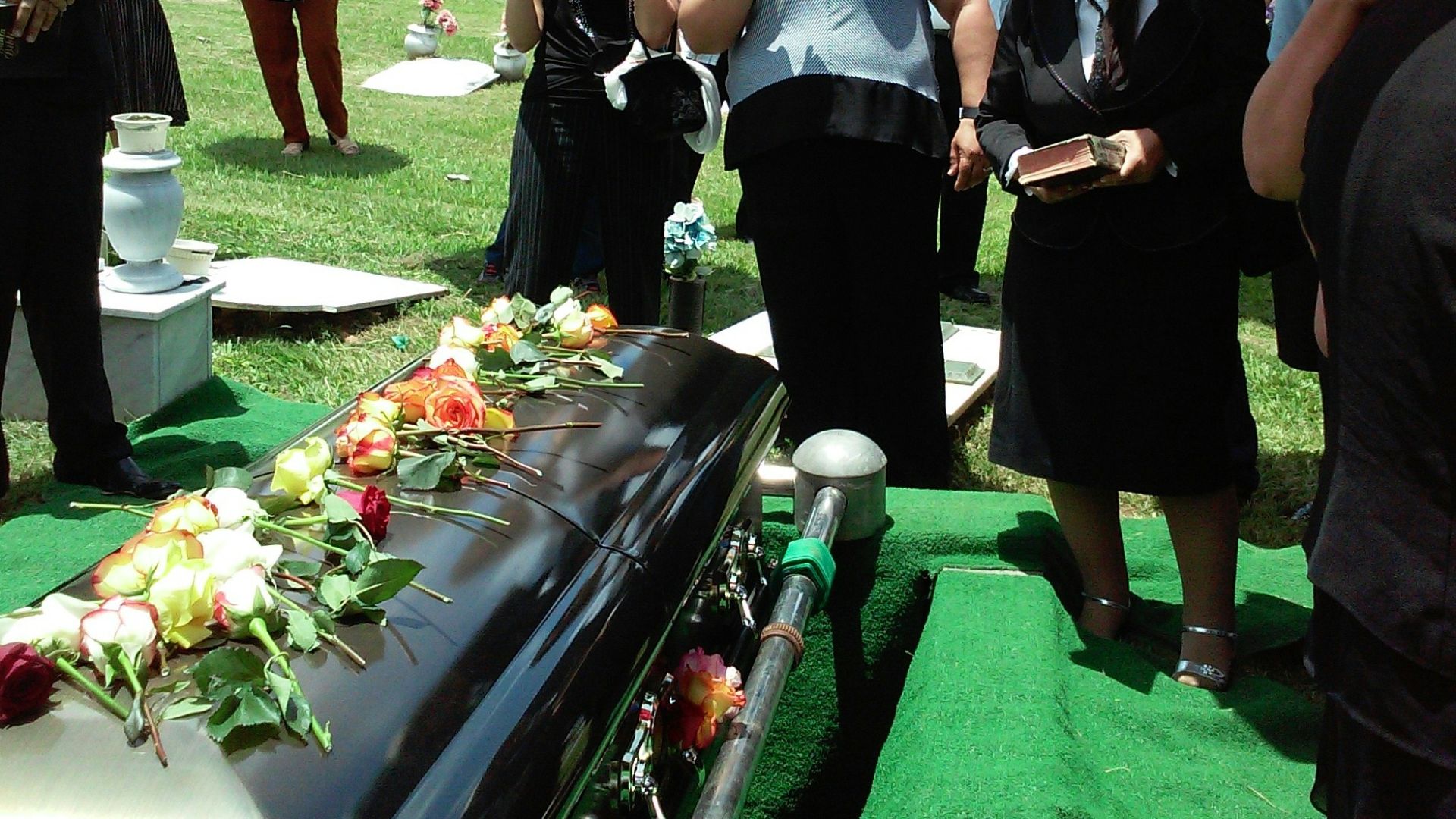 group of people attending burial
