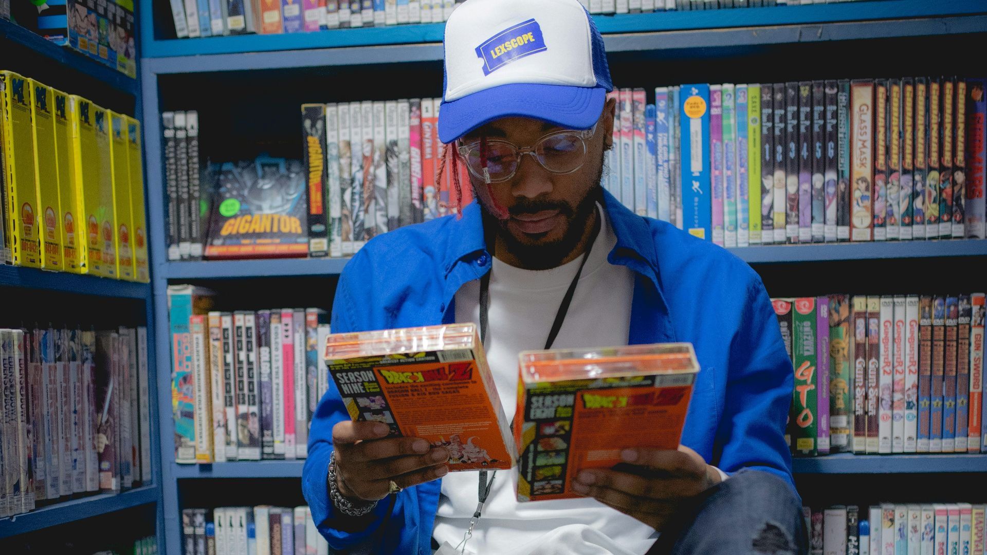 a man sitting on the floor reading a book