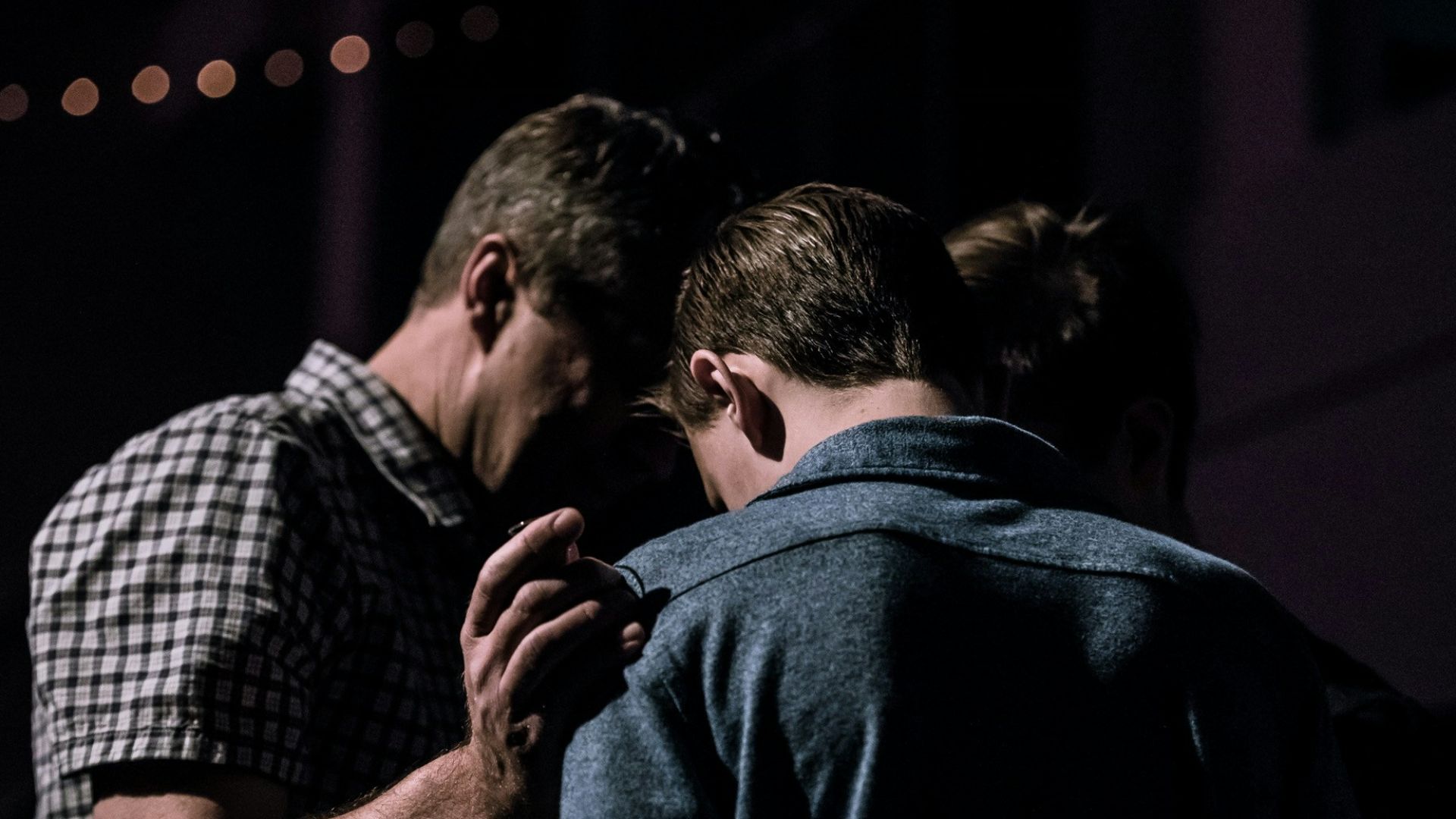 men touching each other's foreheads