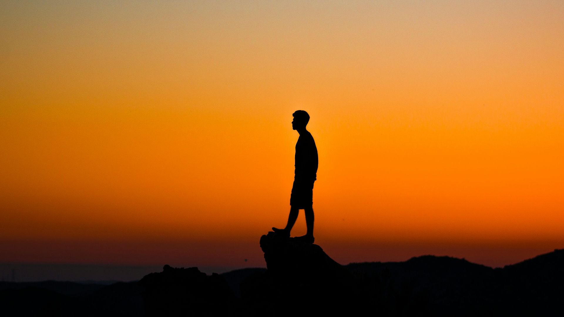 silhouette of man during sunset