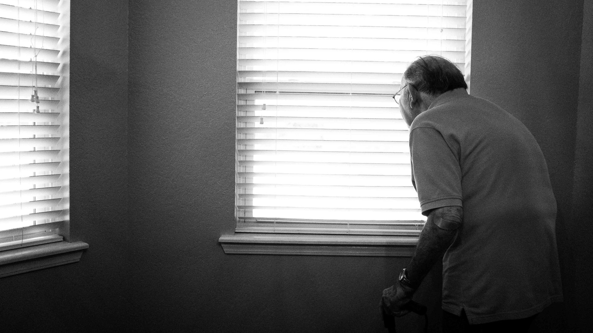 man standing inside white painted room