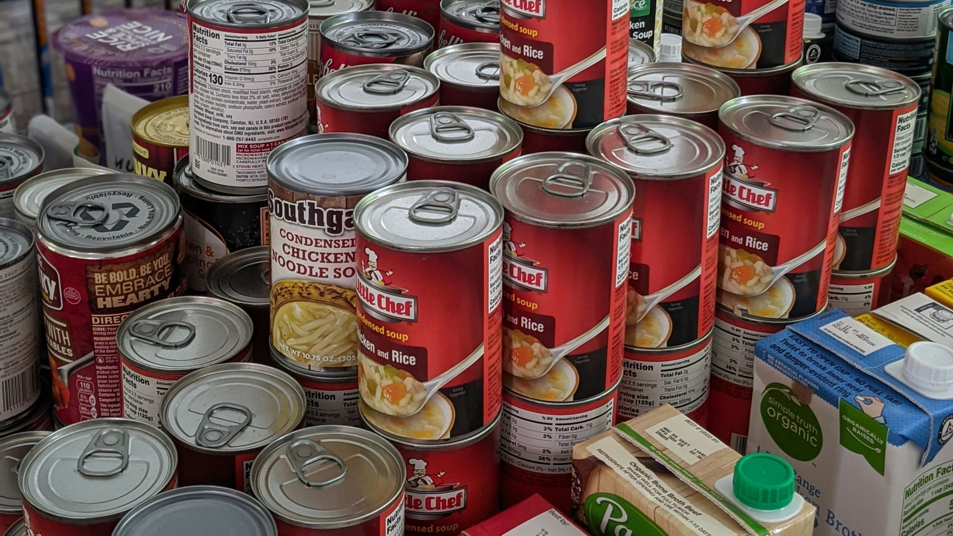 red and white labeled cans