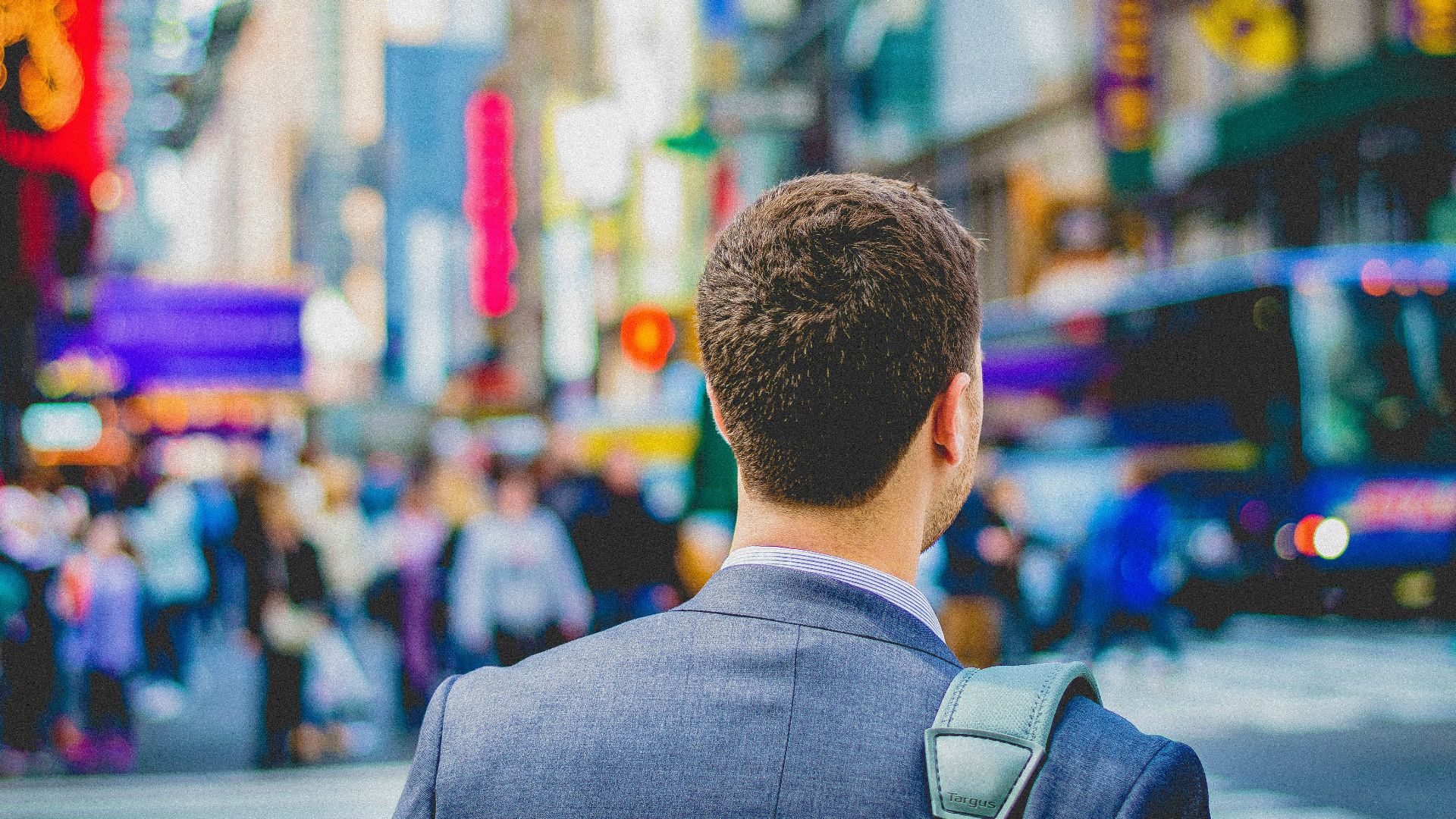 shallow focus photography of man in suit jacket's back