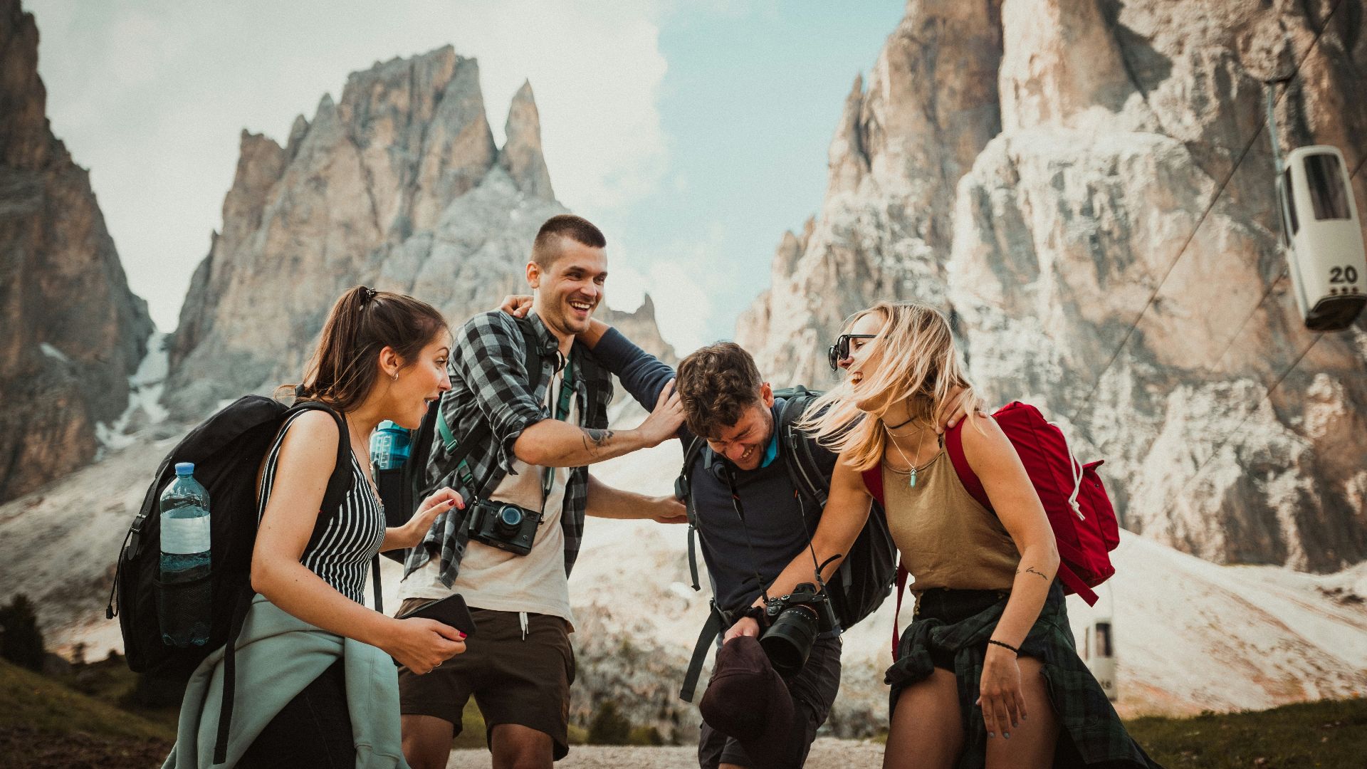 low-angle photography of two men playing beside two women
