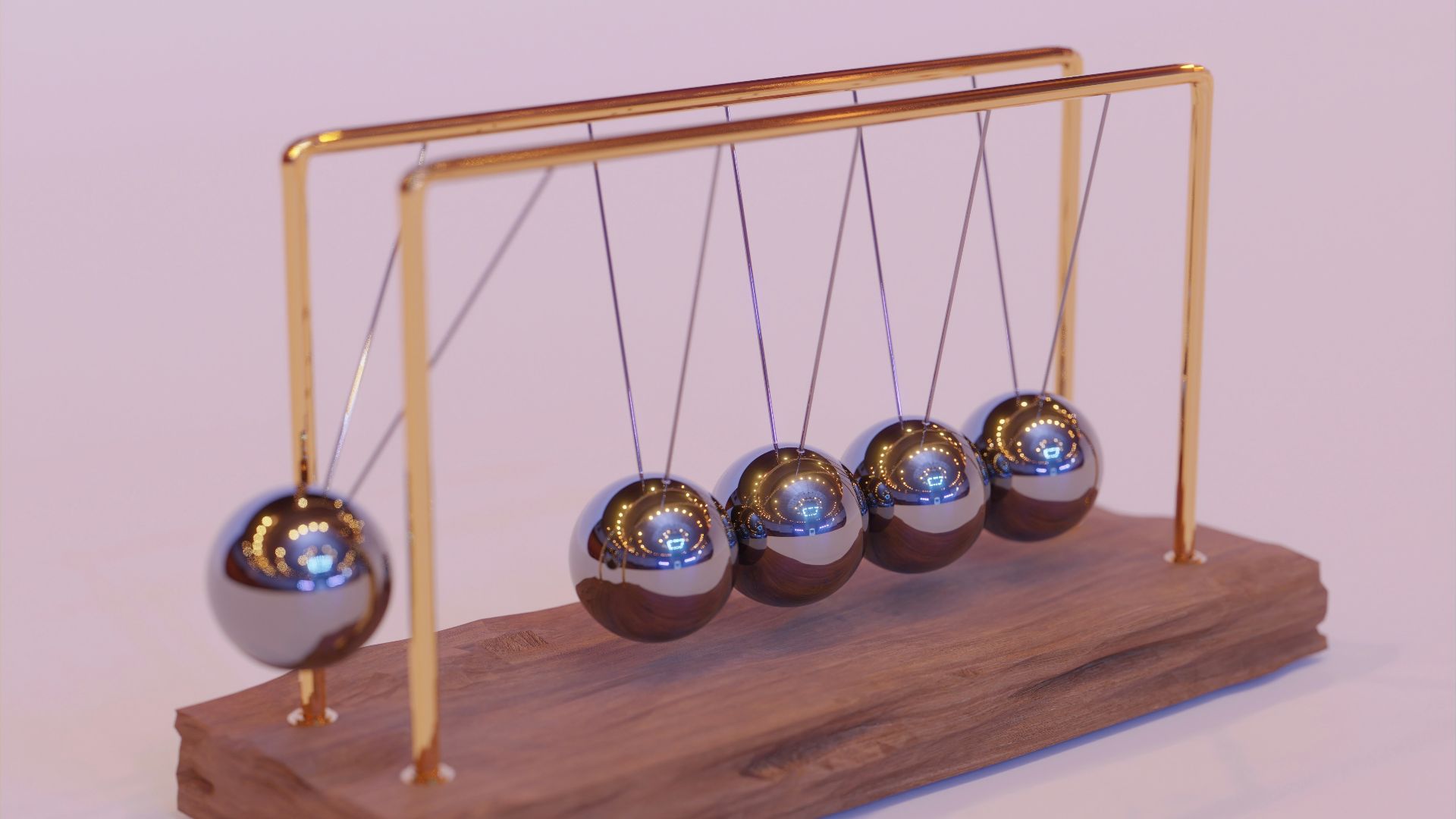 a wooden stand with three metal balls on it