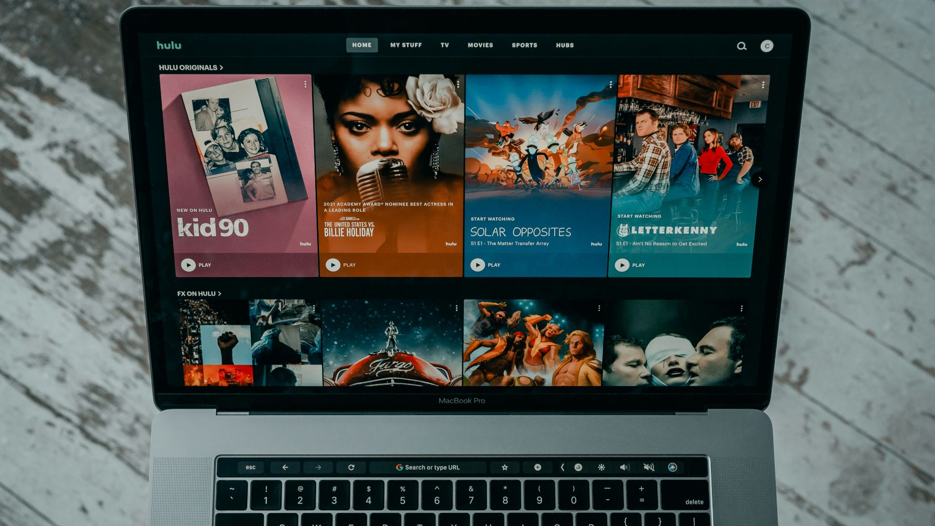 macbook pro on white table