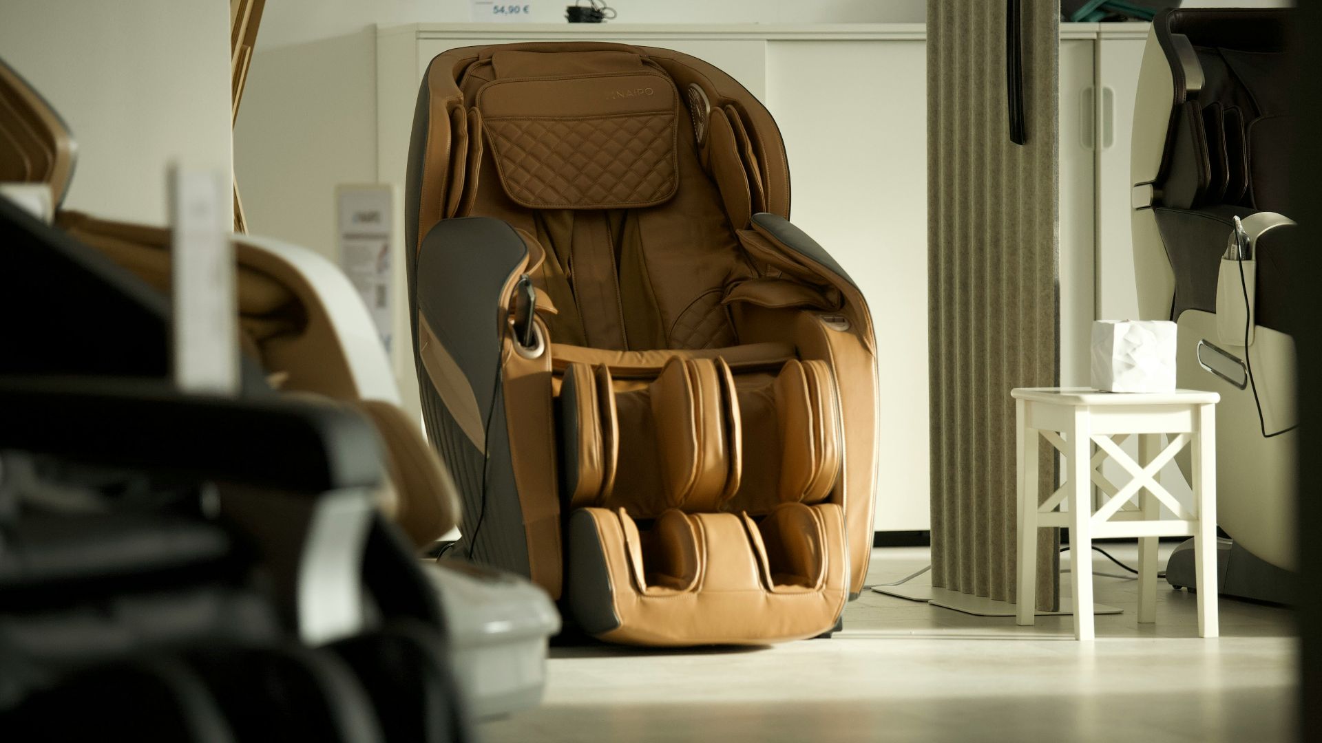 brown and black leather backpack on white wooden table