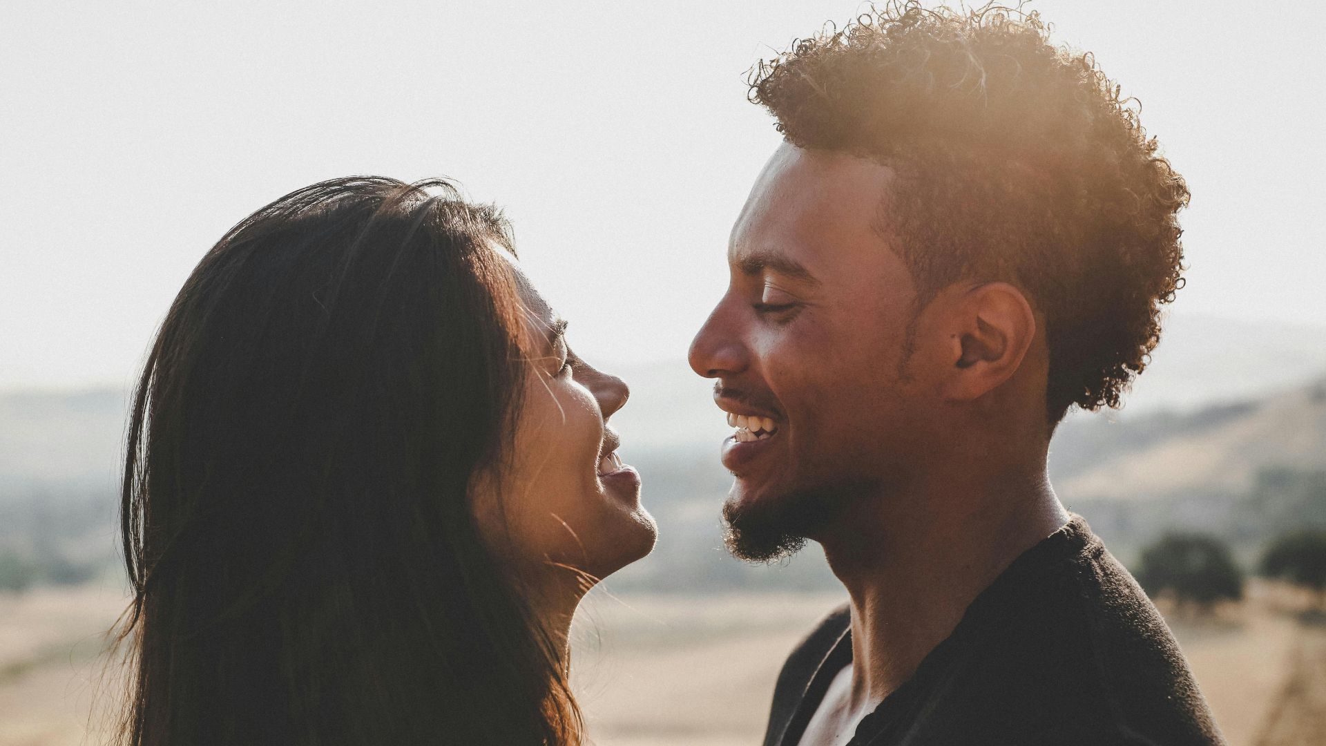 man and woman facing