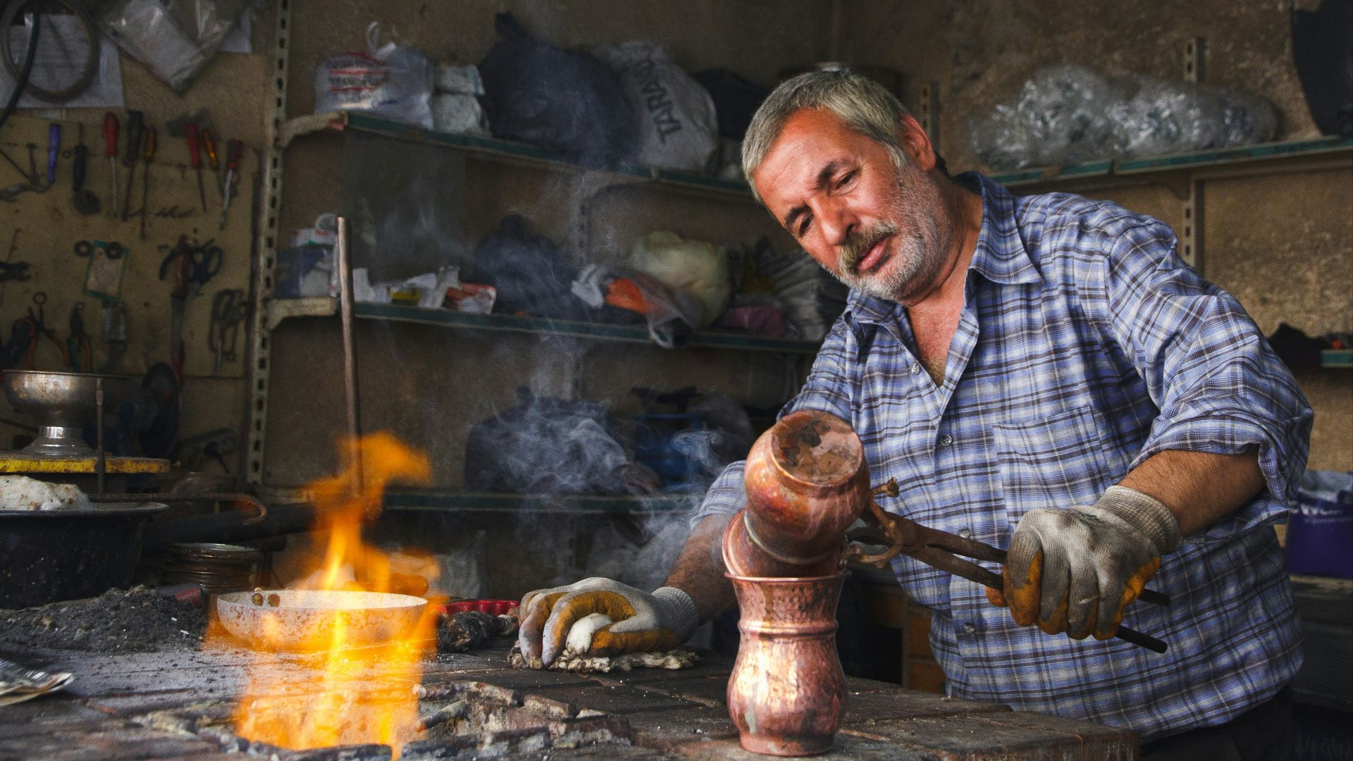 man holding brown hand tool