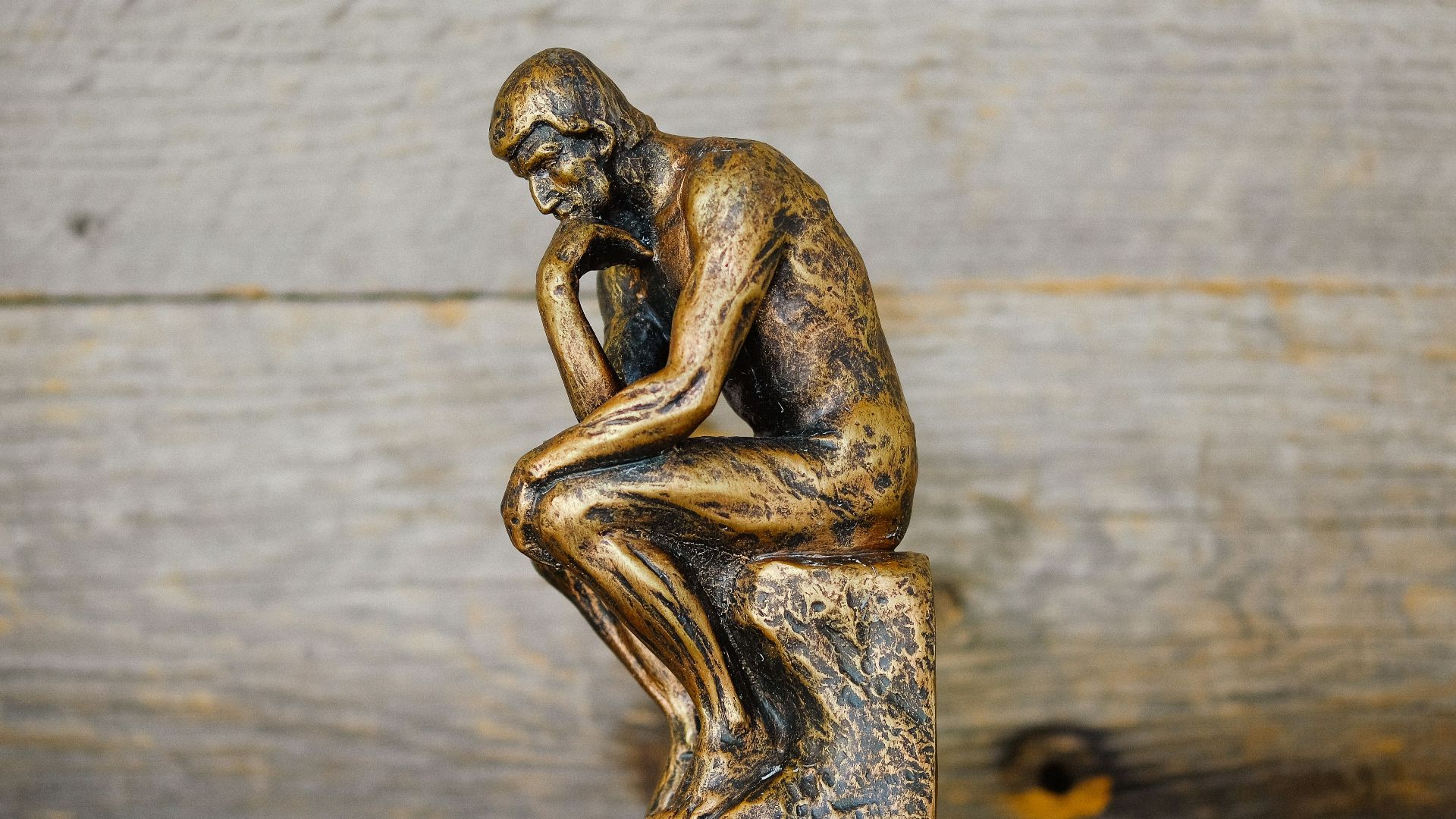 green ceramic statue of a man