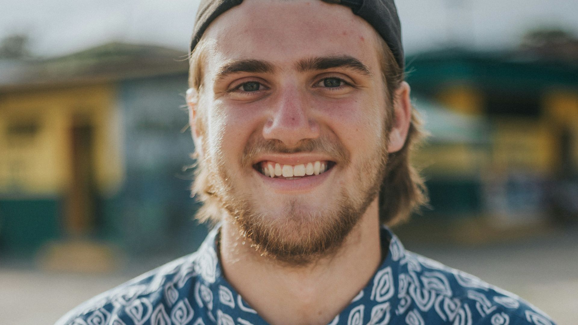 person wearing blue top smiling