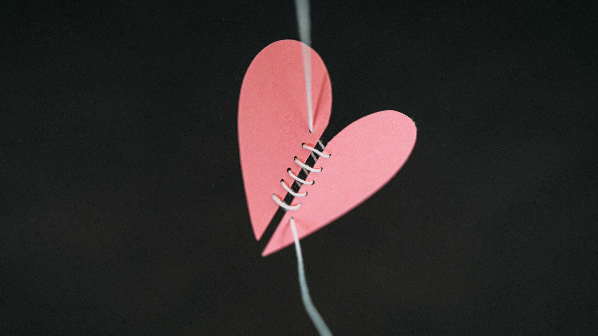 a paper heart hanging from a string