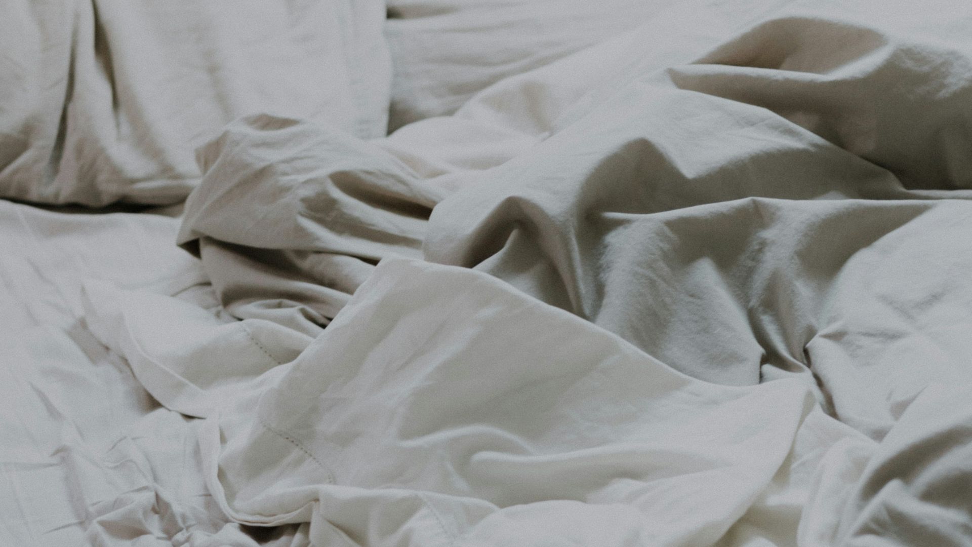 white pillows and bed comforter