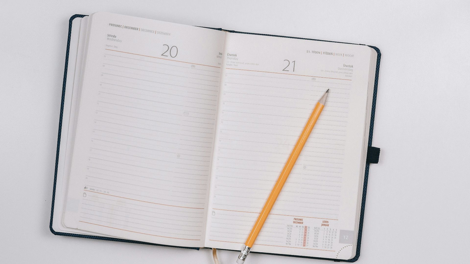 pencil on opened notebook